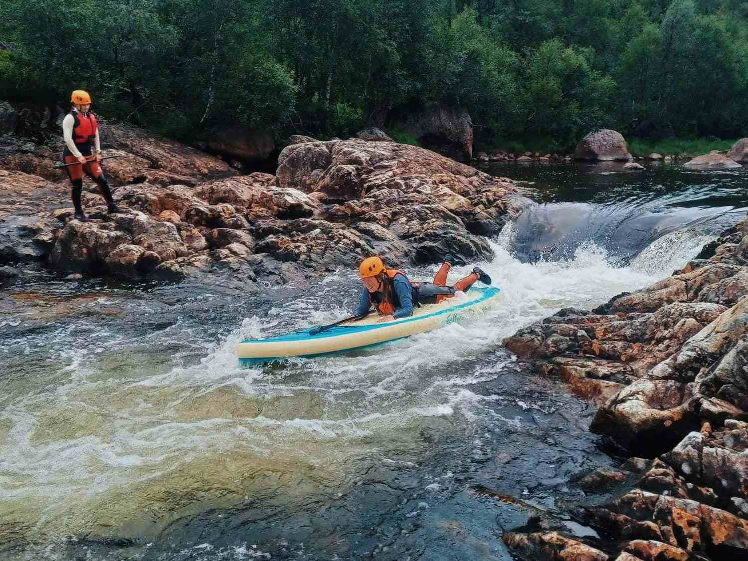 people on stand up paddling boards in sirdal