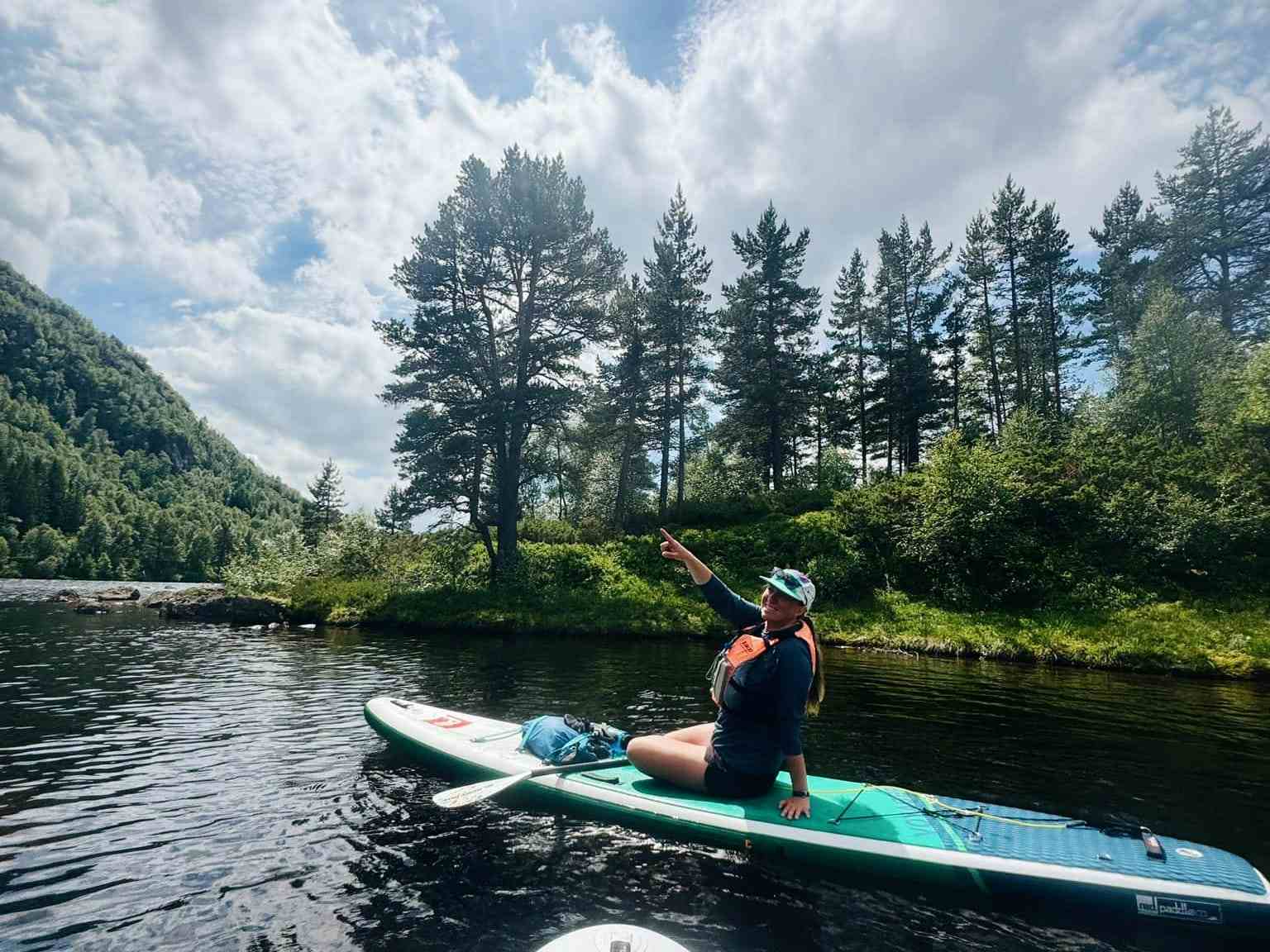 people on stand up paddling boards in sirdal