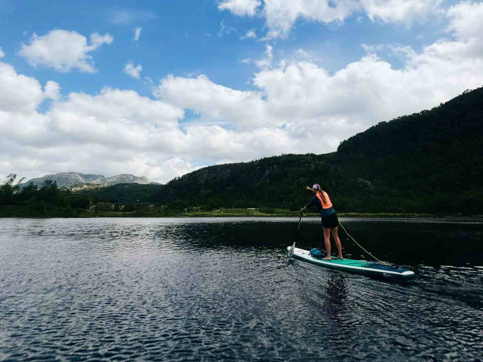 people on stand up paddling boards in sirdal